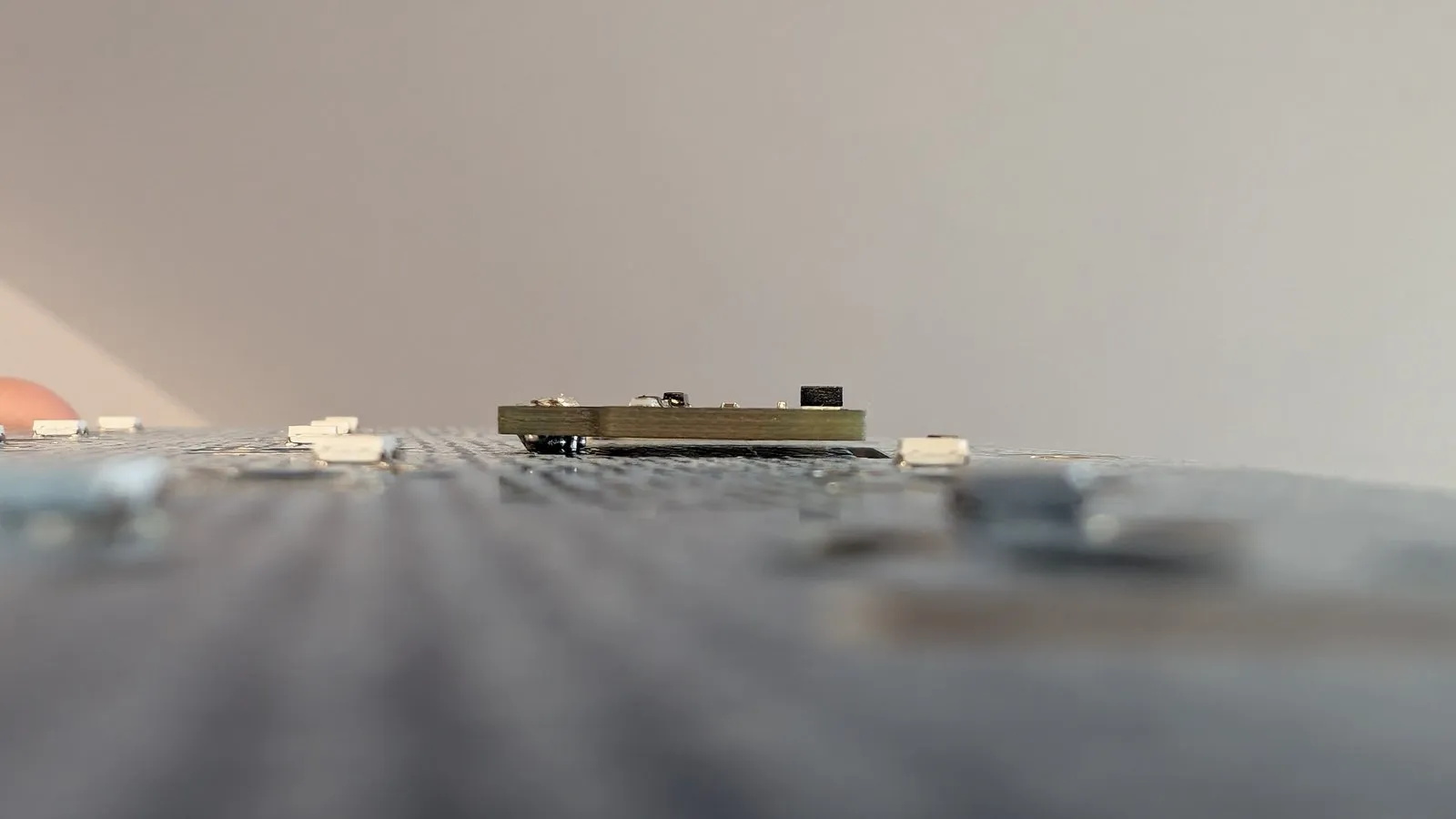 Folded paper used as a spacer under the sensor