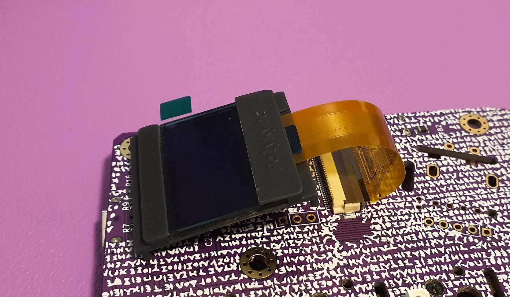 Status display in its holder